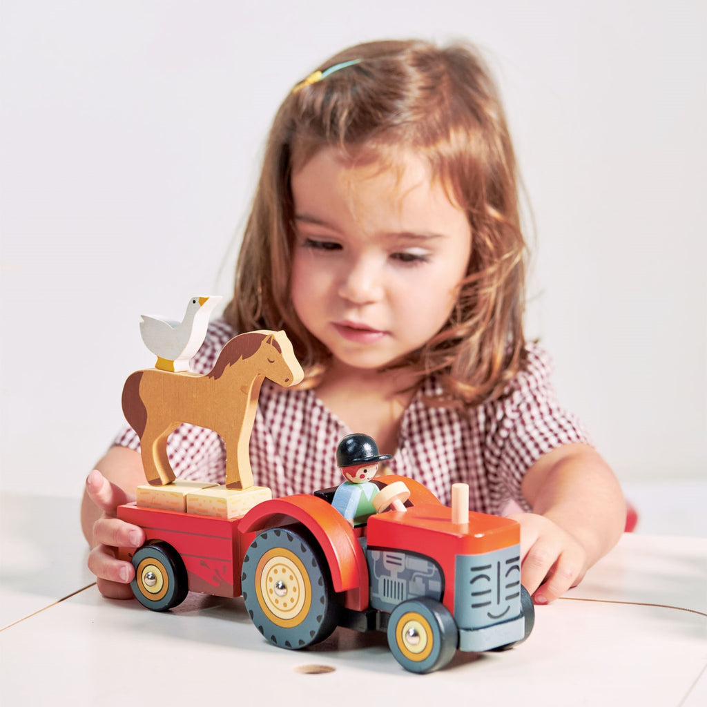 red wooden toy tractor for farm