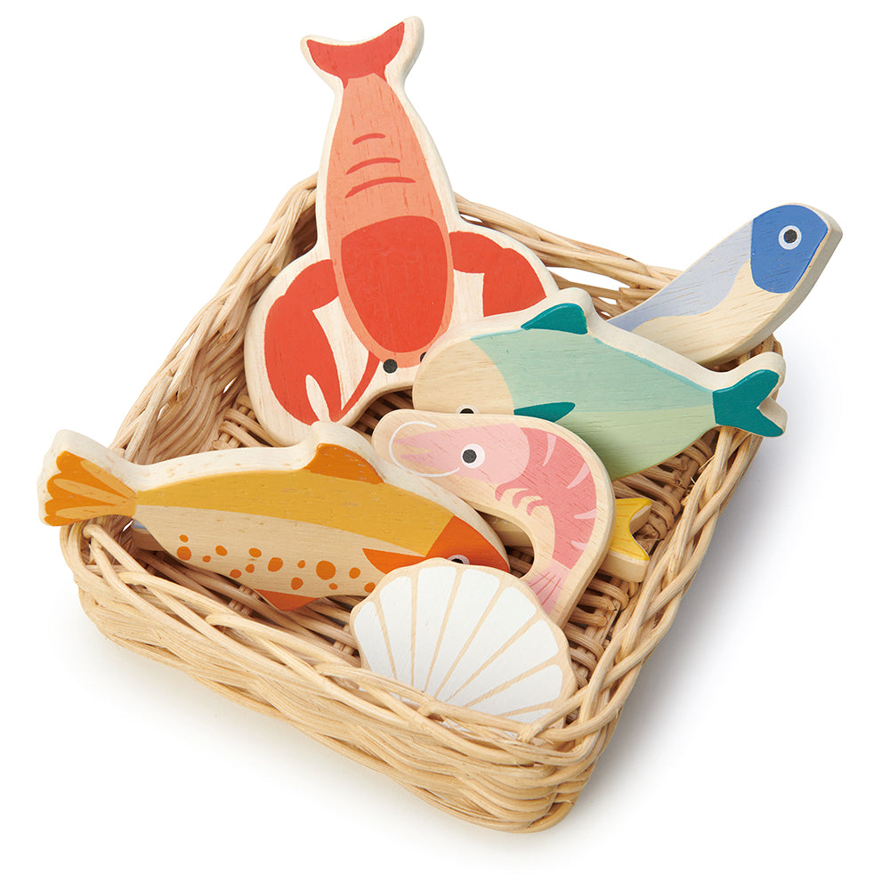 A hand crafted wicker basket with wooden lobster, plaice, mackerel, herring, whitebait, prawn and scallop. Part of our Market day Range and an accessory to our gorgeous Farmers Market.
