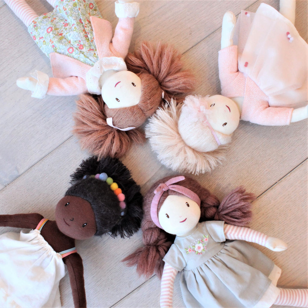 plastic-free rag soft doll with rainbow hair band and white dress
