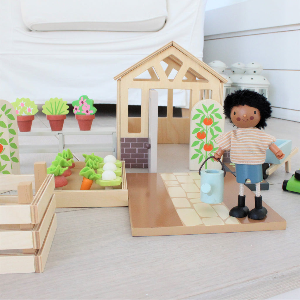 tender leaf toys wood greenhouse garden set for children dolls house extension pack with vegetable patch flowers lawnmower watering can seed tray and an opening door. a perfect addition to your dollies.