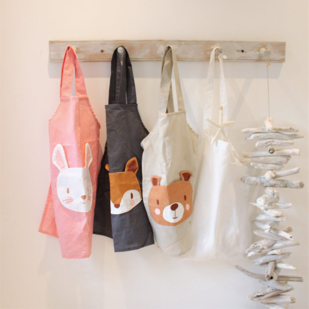 linen apron for children with bunny rabbit pocket machine washable and plastic-free in pink