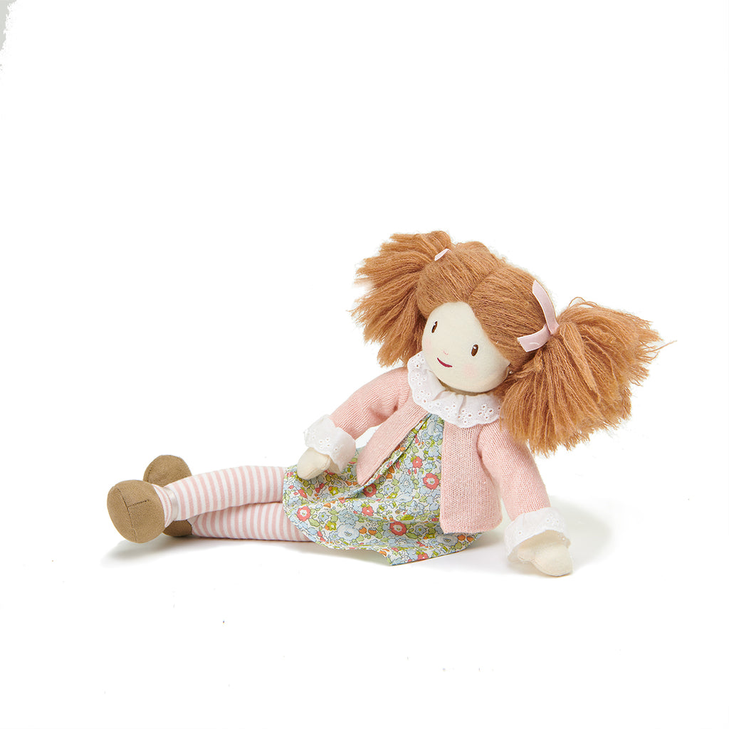 plastic-free rag soft doll with bunches and floral dress with pink cardigan