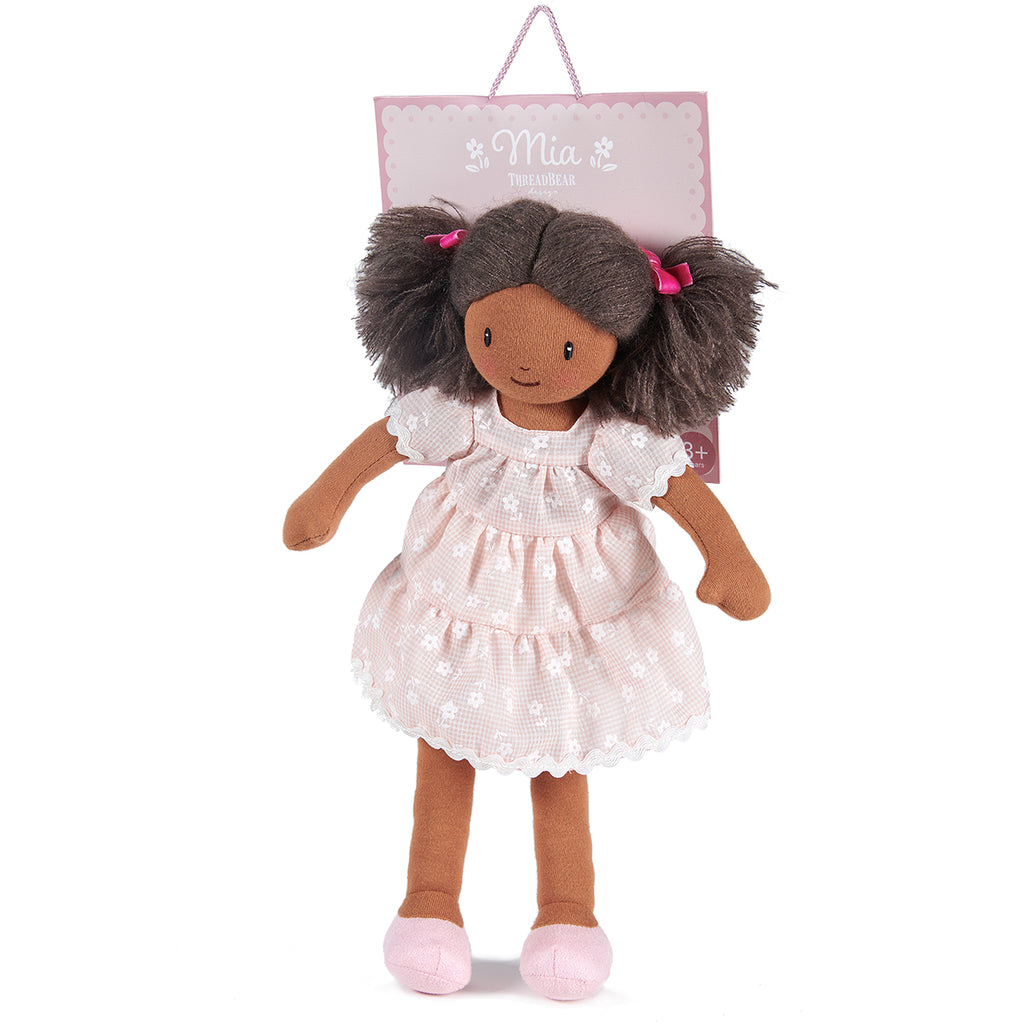 mia rag doll with dark hair embroidered face and floral tiered dress. completely plastic-free