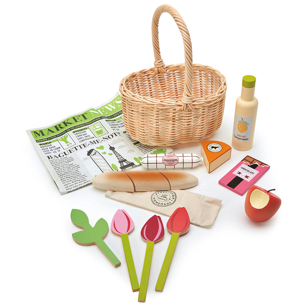 Tender Leaf wooden shopping wicker basket pretend play food set for children with newspaper, apple, lemonade chocolate flowers tulips and some cheese