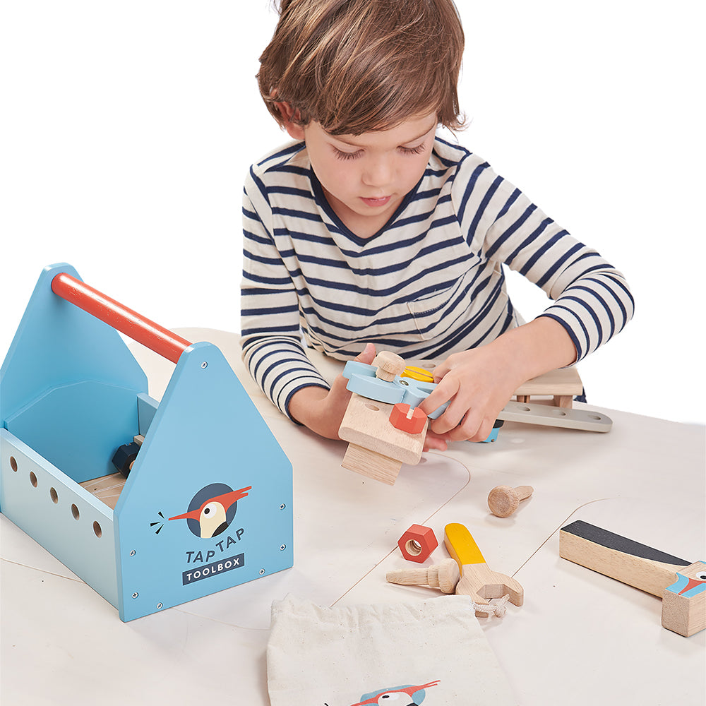 A plastic free tool box toy for children in blue with lots of accessories including hammer wooden nails nuts bolts and screws lets your child play creatively