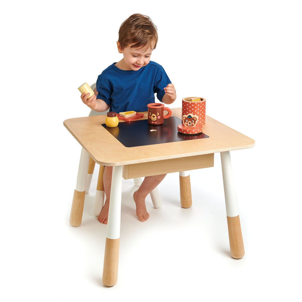 Tender Leaf Toys wooden table for children with a hidden compartment to store crayons and art equipment or toys